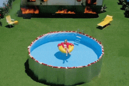 Animated gif of Taylor Swift floating in an above ground swimming pool saying “you need to calm down”