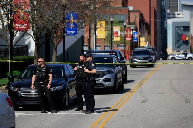 Police in front of the Louisville bank brach after the shooting