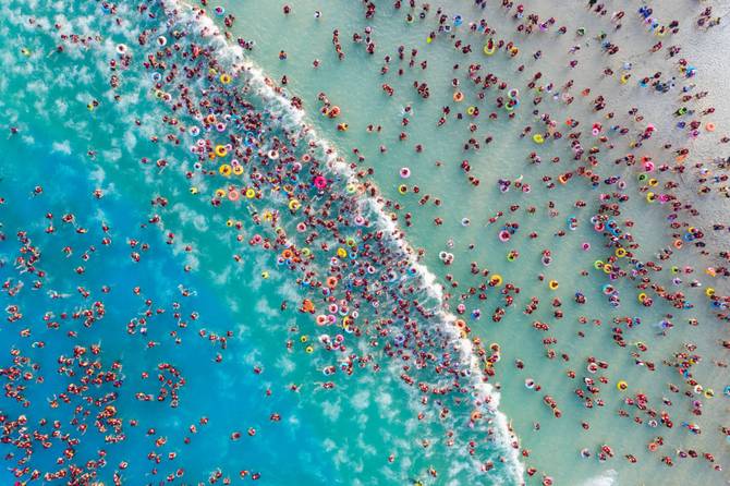 Aerial view of tourists cooling off at a water park in summer on June 27, 2023 in Zhengzhou, Henan Province of China