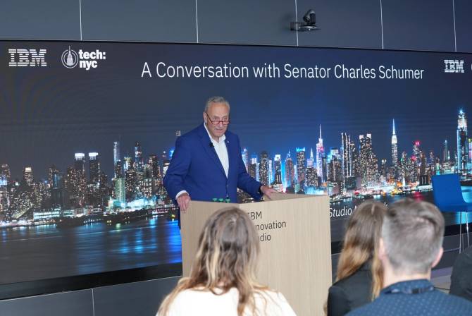 Senator Chuck Schumer speaks from the podium at an event in IBM's Manhattan office.