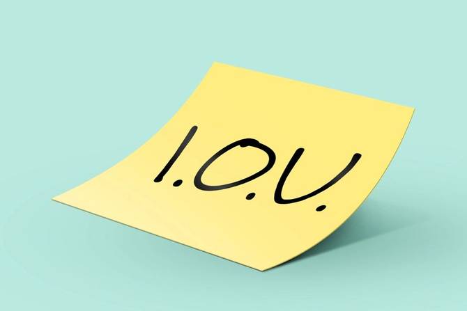 an 'I.O.U.' post-it note