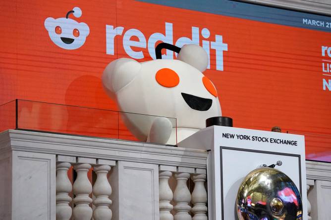 The Reddit mascot rings the opening bell at the New York Stock Exchange