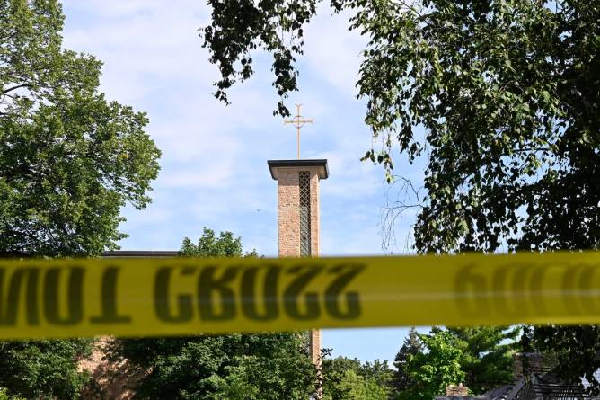 The Annunciation Catholic Church is seen behind police tape following a mass shooting on August 27, 2025 in Minneapolis, Minnesota.