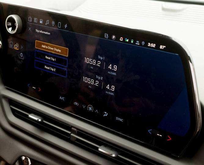 A screen in the Chevy Silverado EV displays the 1,059-mile distance.