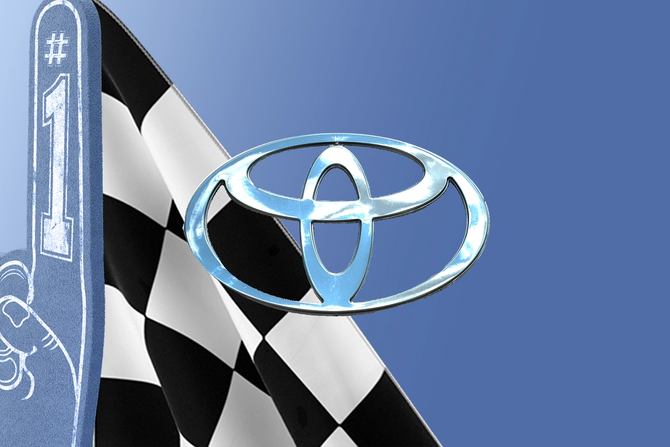 Toyota logo with a checkered flag and a No. 1 foam finger in the background 