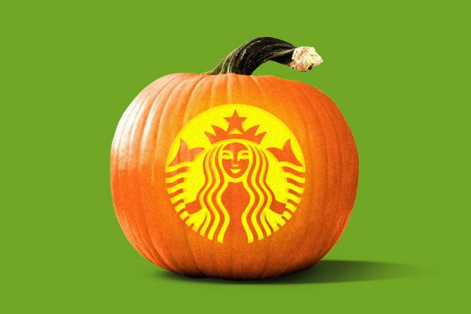 A pumpkin with a Starbucks logo carved into it