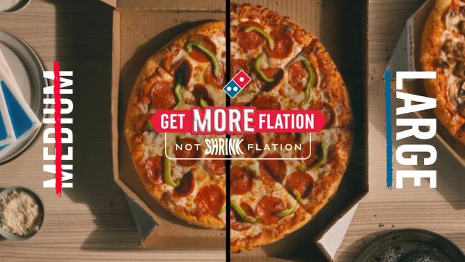 An ad from Domino's highlighting its Moreflation promotion, which allows customers who order two medium pizzas to bump one up to a large for free. 