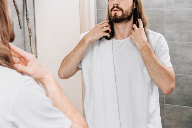 A Jesus model looking at a mirror