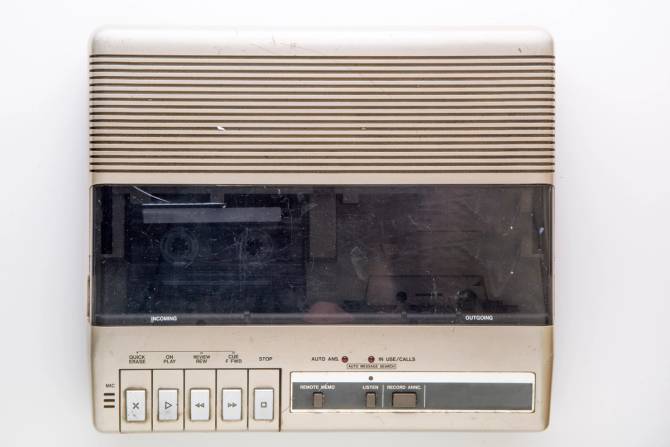 Image of an old answering machine with a cassette.