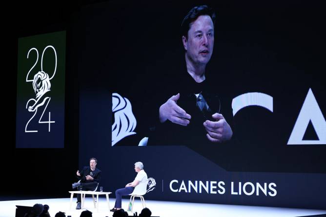 Elon Musk and Mark Read attend 'Exploring the New Frontiers of Innovation: Mark Read in Conversation with Elon Musk' session during the Cannes Lions International Festival Of Creativity 2024 - Day Three on June 19, 2024 in Cannes, France.