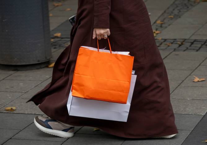 Retail consumer with shopping bags