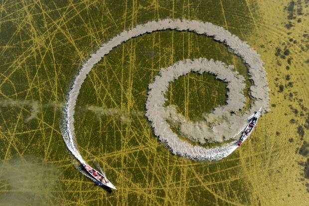 An aerial view shows boats sailing in the marshes of Chibayish in Iraq's southern Dhi Qar province