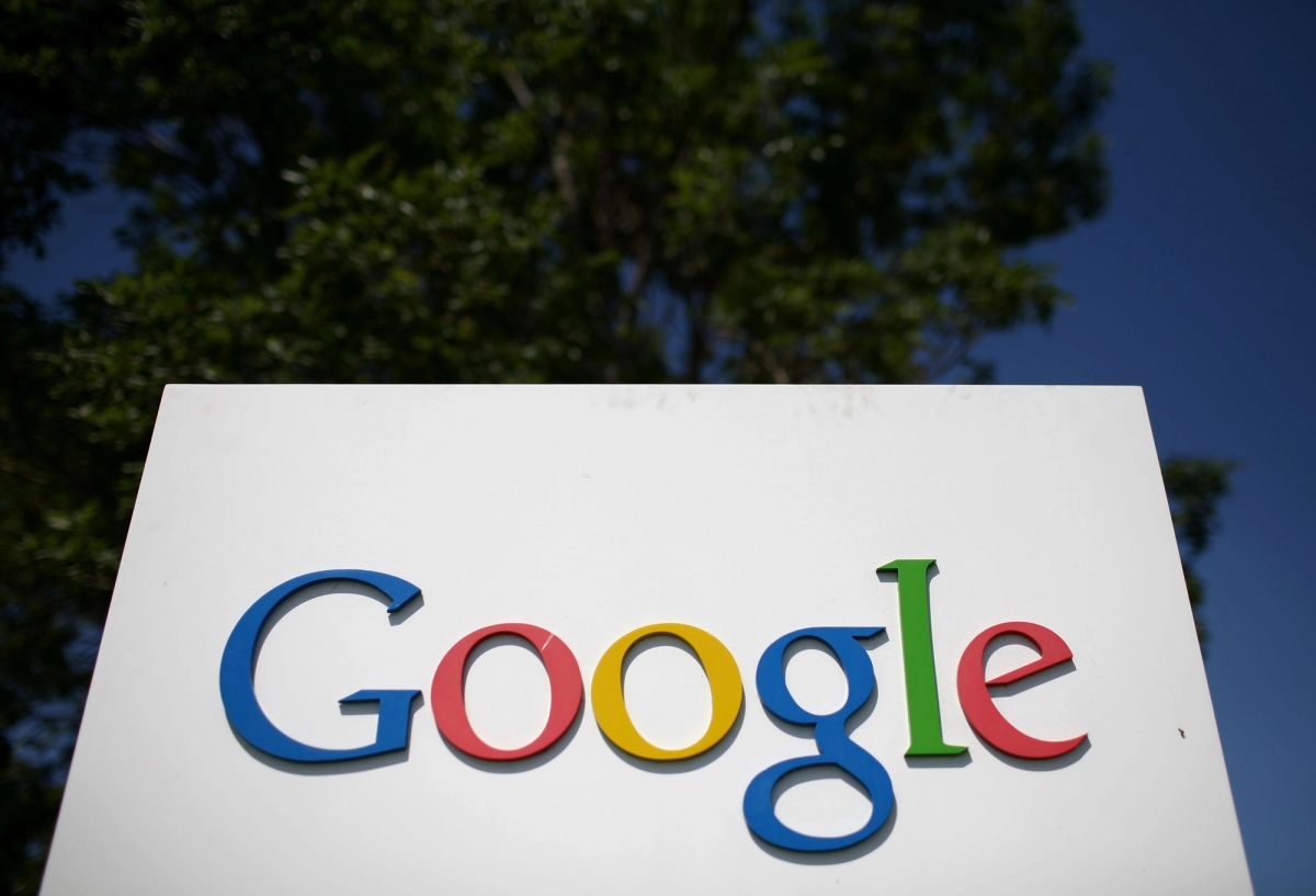 Google exterior sign with logo letters mounted on a white stone.