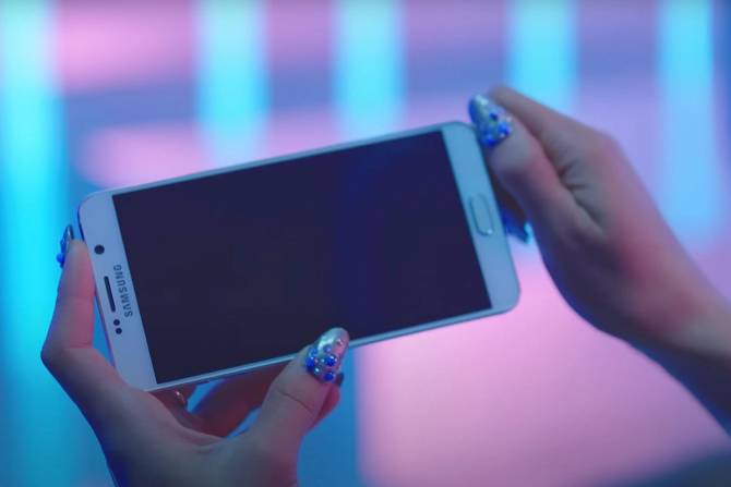 a screenshot from Ariana Grande's music video "Focus" showing a Samsung phone