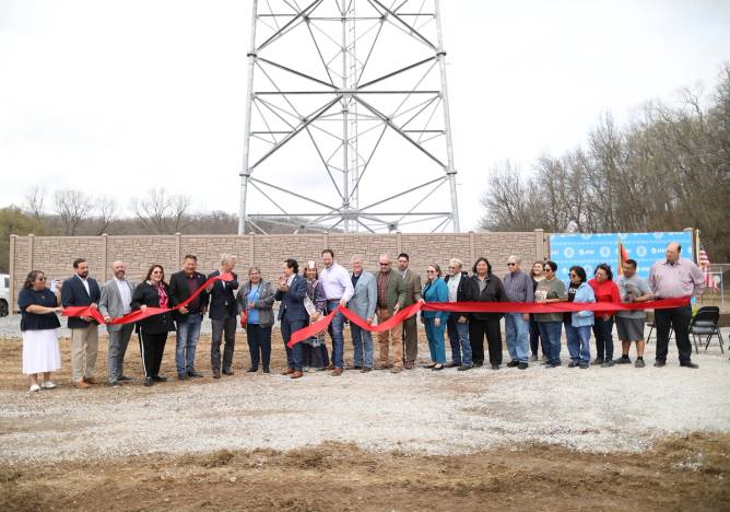 People attend a mobile tower ribbon-cutting in Kenwood, Oklahoma.