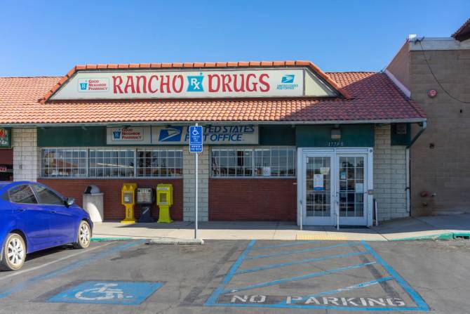 A ranch style building depicting an independent pharmacy