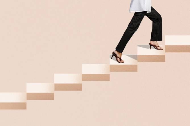 Close up of a woman walking up stairs
