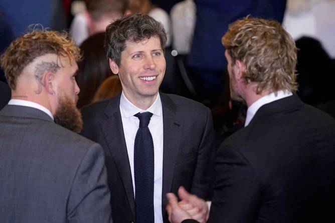 Sam Altman, chief executive officer of OpenAI Inc. (C) chats with boxer Jake Paul (L) and wrestler Logan Paul as they arrive for the inauguration