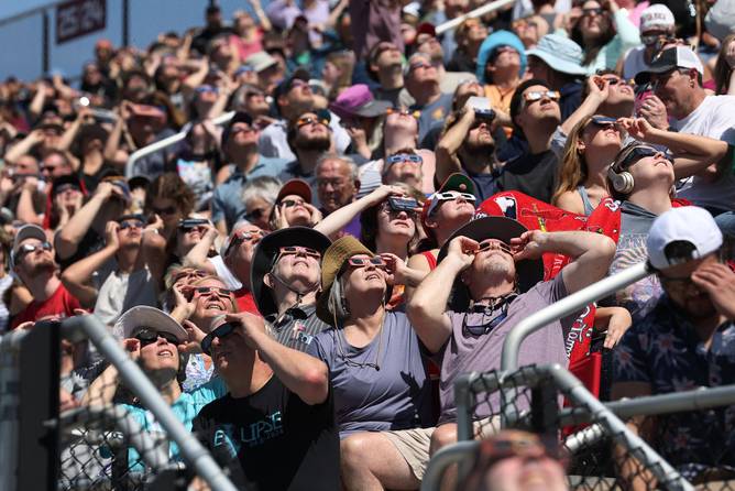 People view the start of the total eclipse on the campus of Southern Illinois University on April 08, 2024 in Carbondale, Illinois