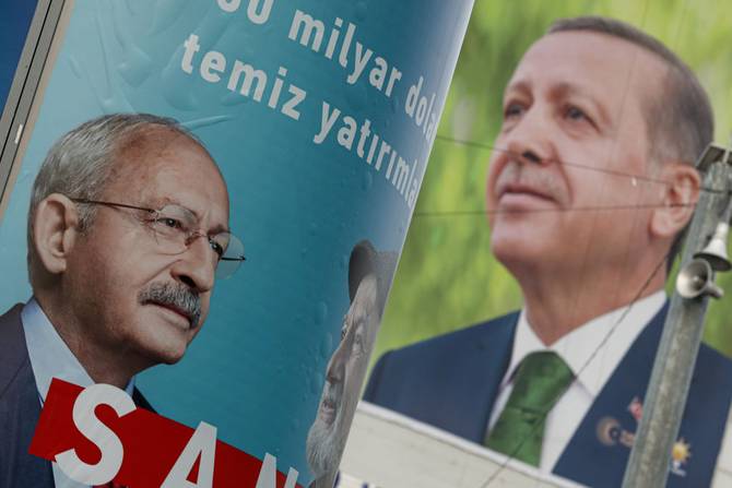 Campaign posters of the 13th Presidential candidate and Republican People's Party (CHP) Chairman Kemal Klçdarolu (L) and the President of the Republic of Turkey and Justice Development Party (AKP) President Recep Tayyip Erdoan (R) are seen displayed