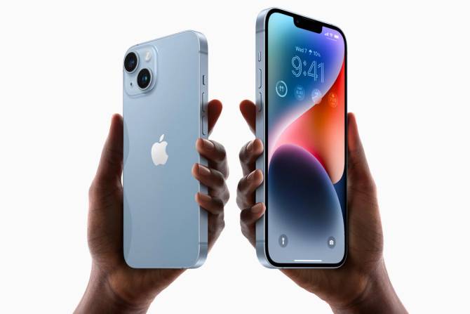 Two hands holding the latest iPhones. 