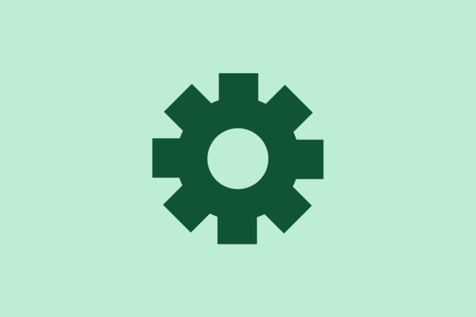 Green gear on a light green background