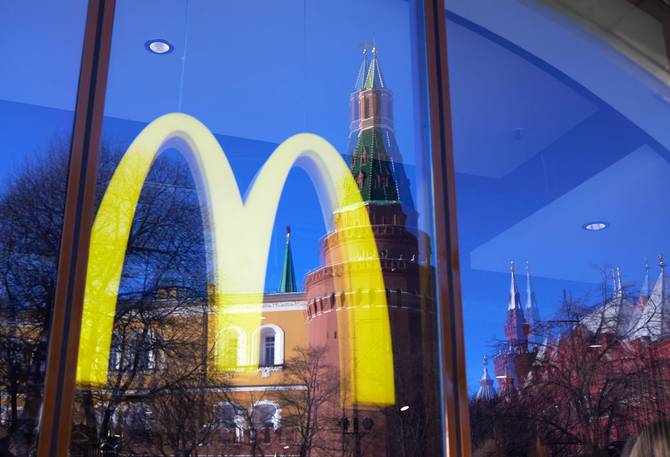 The Kremlin towers is reflected in a McDonald's display on March 9, 2022 in Moscow, Russia