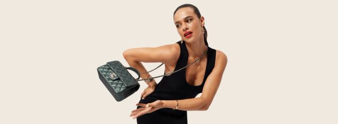 Model showing off a luxury purse