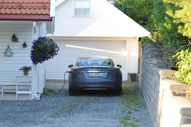 Tesla parked in a driveway 