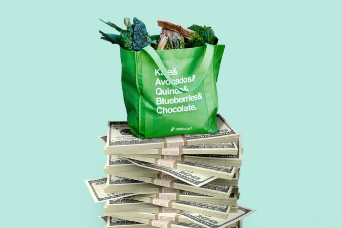 instacart grocery bag sitting on pile of money