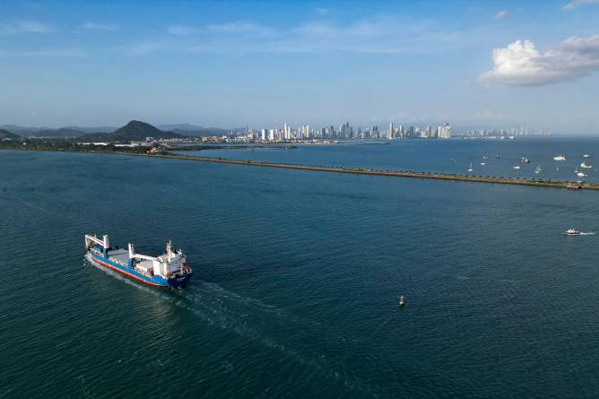 In this aerial view a cargo ship enters the Panama Canal on the Pacific Ocean side in Panama City on February 4, 2025.