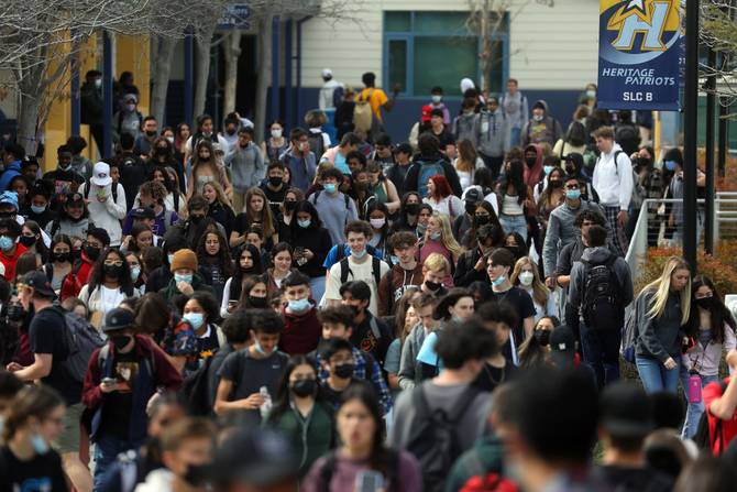 Students move across the Heritage High School campus between class periods on Tuesday, March 1, 2022, in Brentwood, Calif.