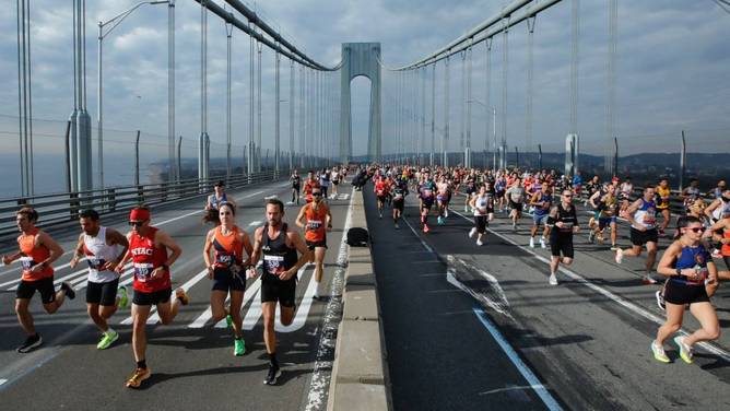 Runners cross the Verrazano Bridge before competing in the Men's division during the New York City Marathon