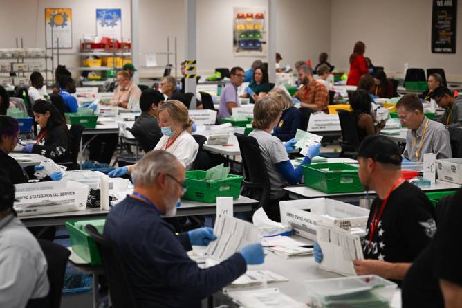 election workers in maricopa county, arizona, process ballots