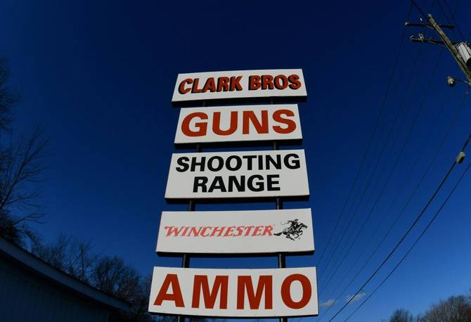 Billboards advertise Clark Brothers gun store and shooting range in Warrenton, Virginia