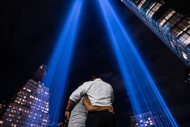 People gather at the Tribute of Light on September 11, 2023 in New York City.