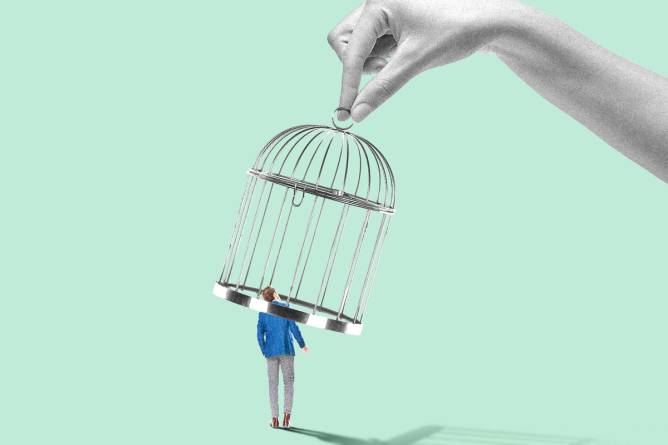 An HR professional stands beneath a cage suspended from above, held by a giant hand.
