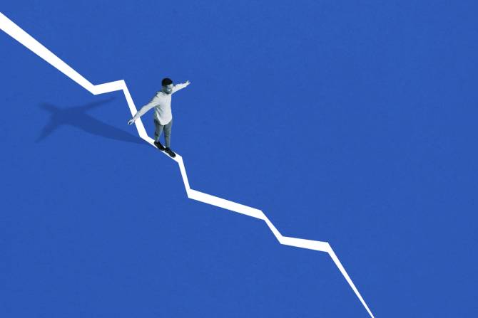 A person balances on an uneven line