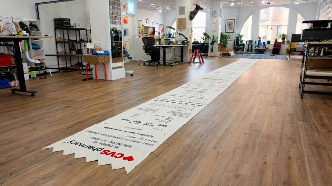 The 50-foot rug of a CVS receipt inside Matty Benedetto's studio.