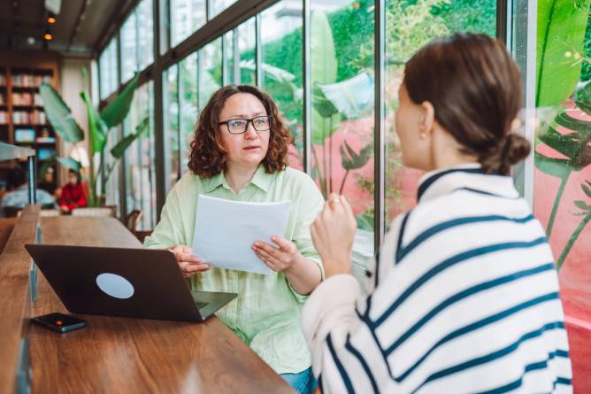 Two people in a job interview in an office