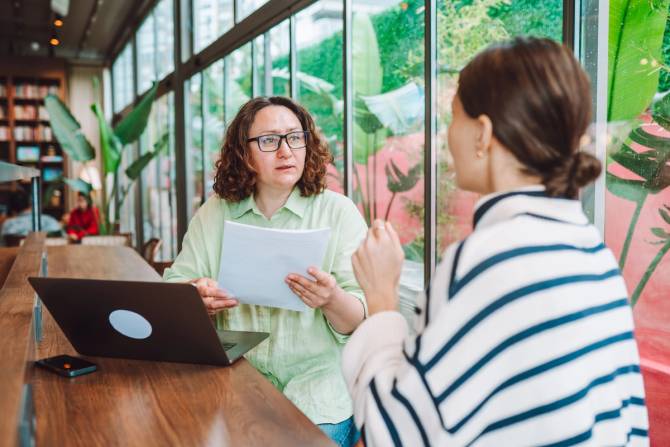 Two people in a job interview in an office