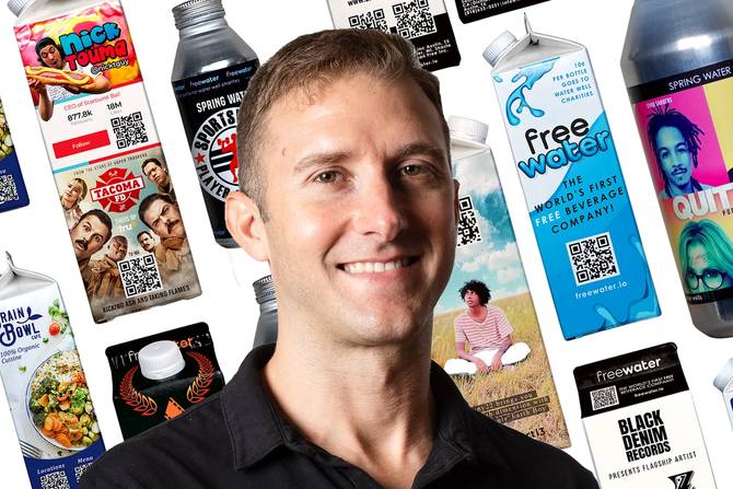FreeWater CEO Josh Cliffords in front of images of water boxes and bottles with ads printed on them.