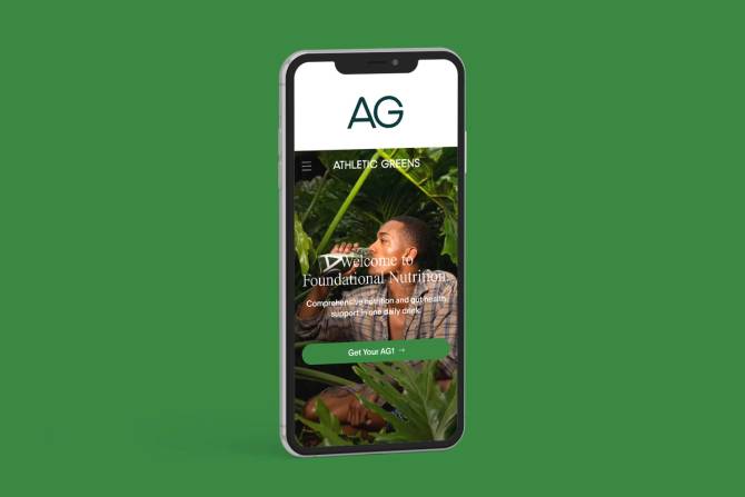 Athletic Greens branding within a phone, on a green background