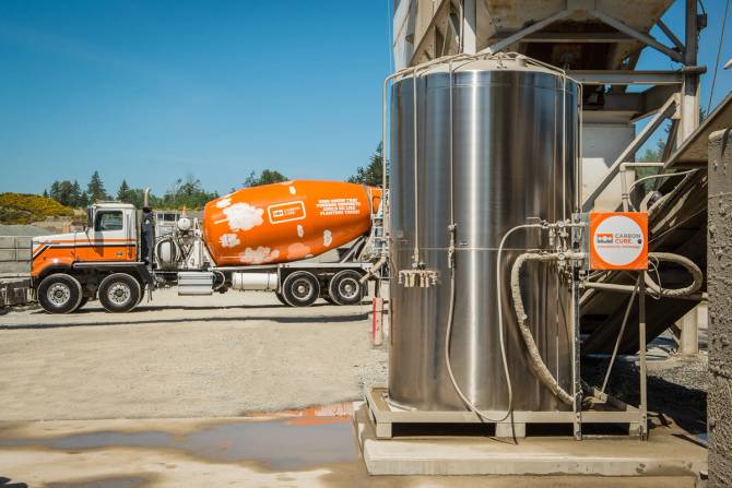 image of carboncure tech in front of a carboncure concrete truck