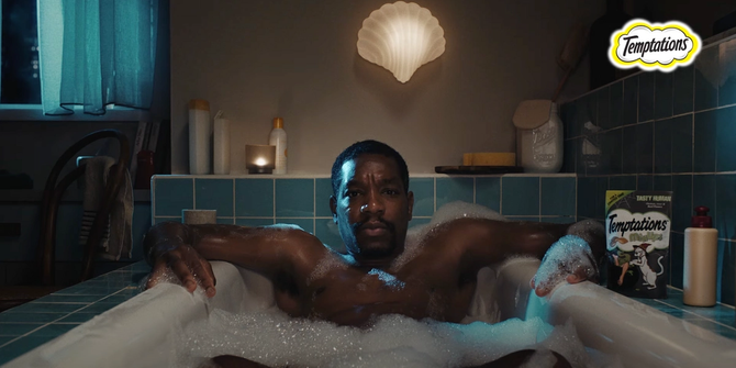 image from Temptations ad showing a man in a bathtub