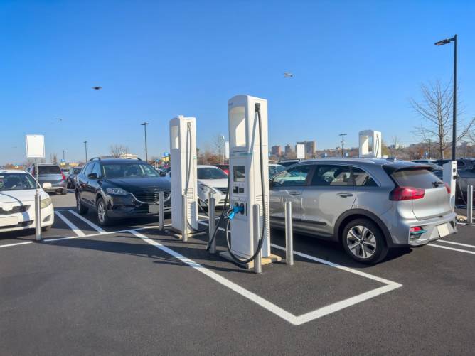 Image of a car being charged at a charging station.