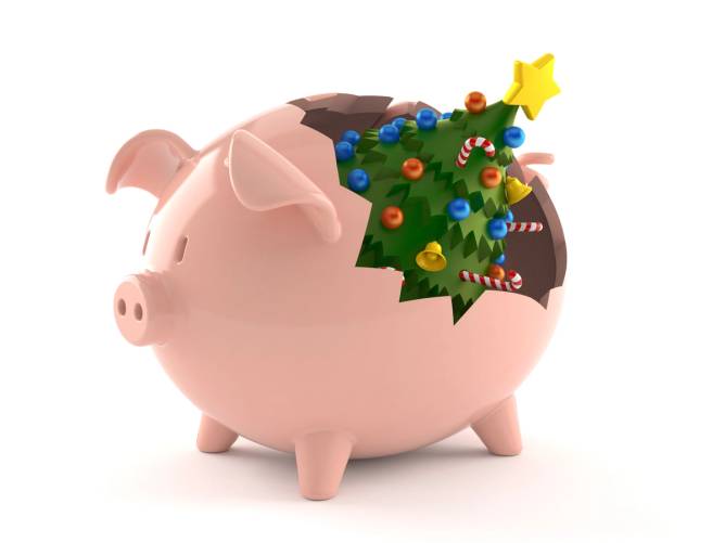 An illustration where a Christmas tree breaks a piggy bank. 