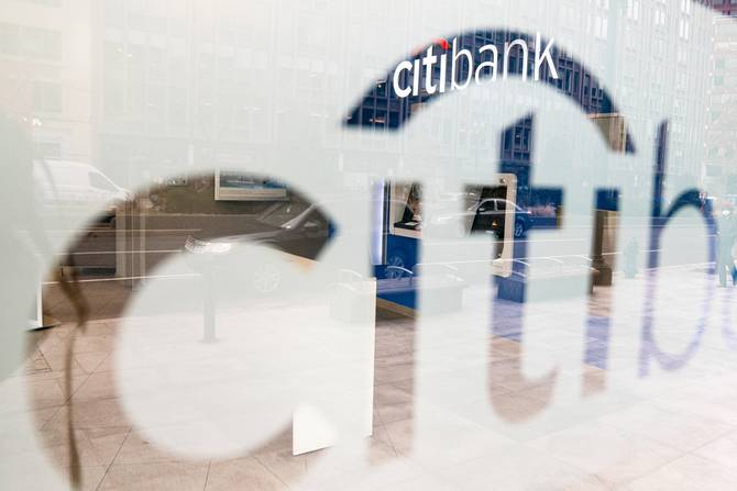 Citibank logo on a window reflecting street