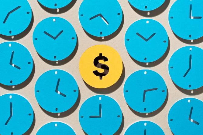 yellow dollar sign surrounded by blue clocks