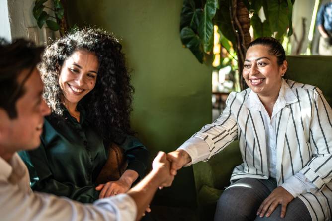 three people smile